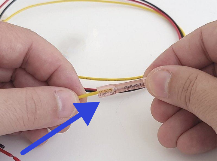 Butt-splice connector crimped on the yellow wire