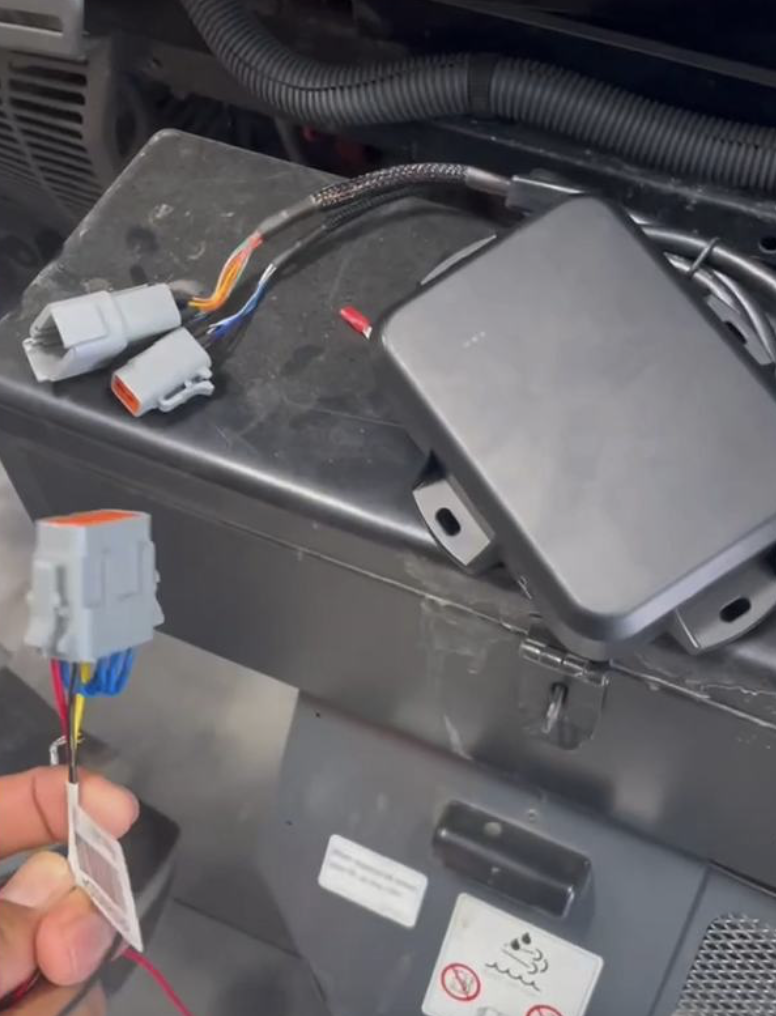 Deutsch connector being plugged into the GPS device